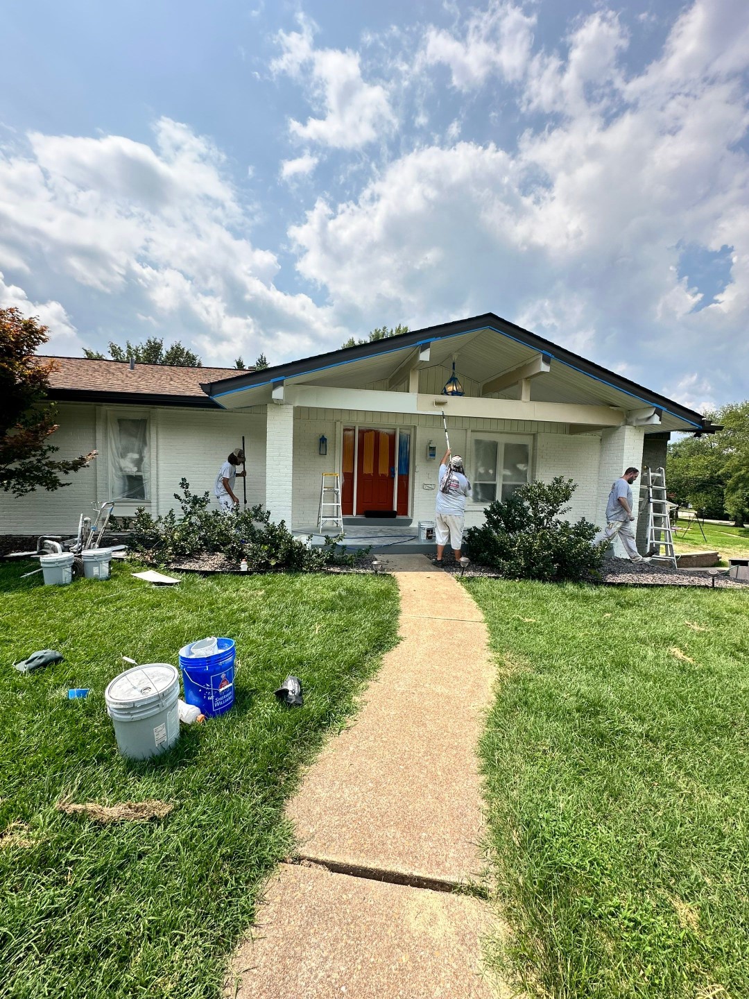 Painters working on the house